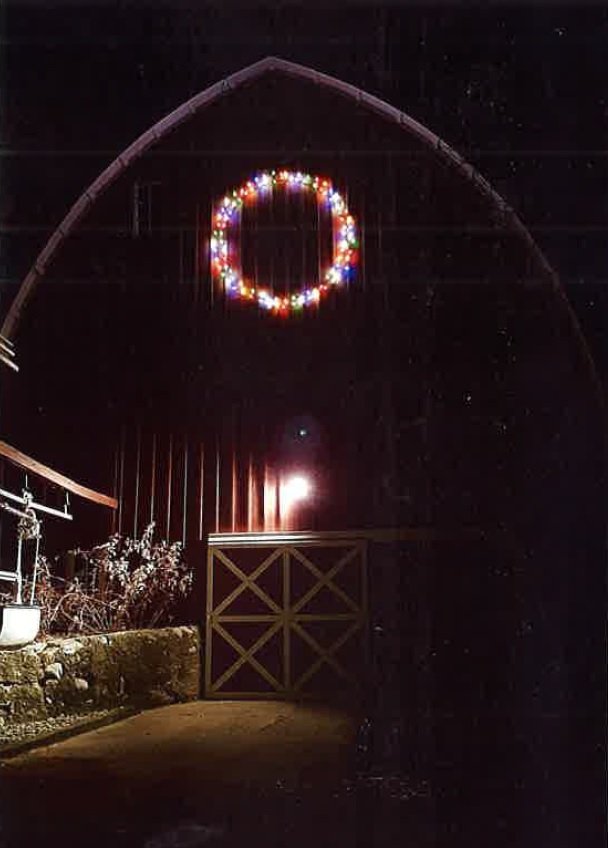 Lighted wreath on 100 Year Old Barn